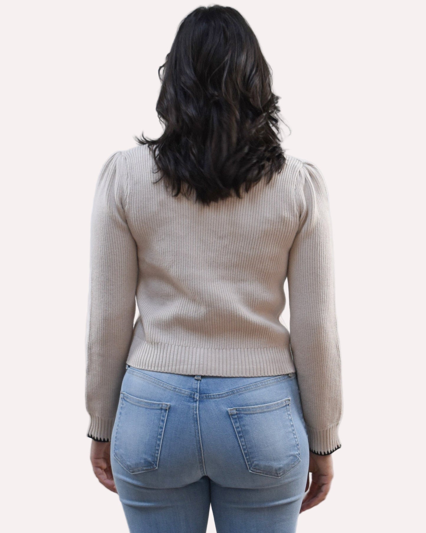 Petite Bow Knit Cardi on soft linen background, featuring a contrast-knit body and delicate bow detail at the neckline.