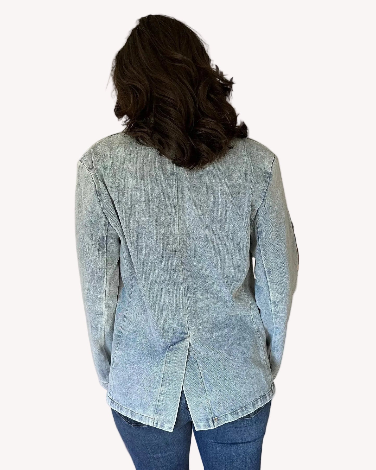 Oversized denim blazer with long sleeves and subtle shoulder pads