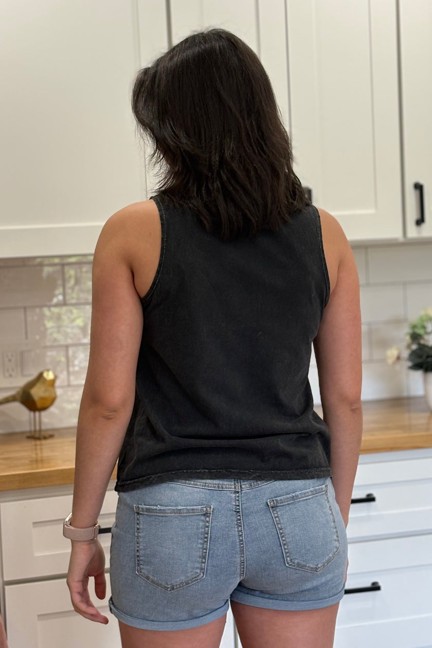 Vintage black mineral-wash “USA EST. 1776” graphic tank in soft cotton with relaxed fit and patriotic design.