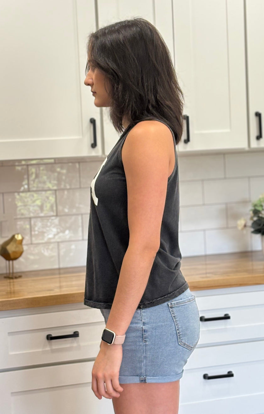 Vintage black mineral-wash “USA EST. 1776” graphic tank in soft cotton with relaxed fit and patriotic design.