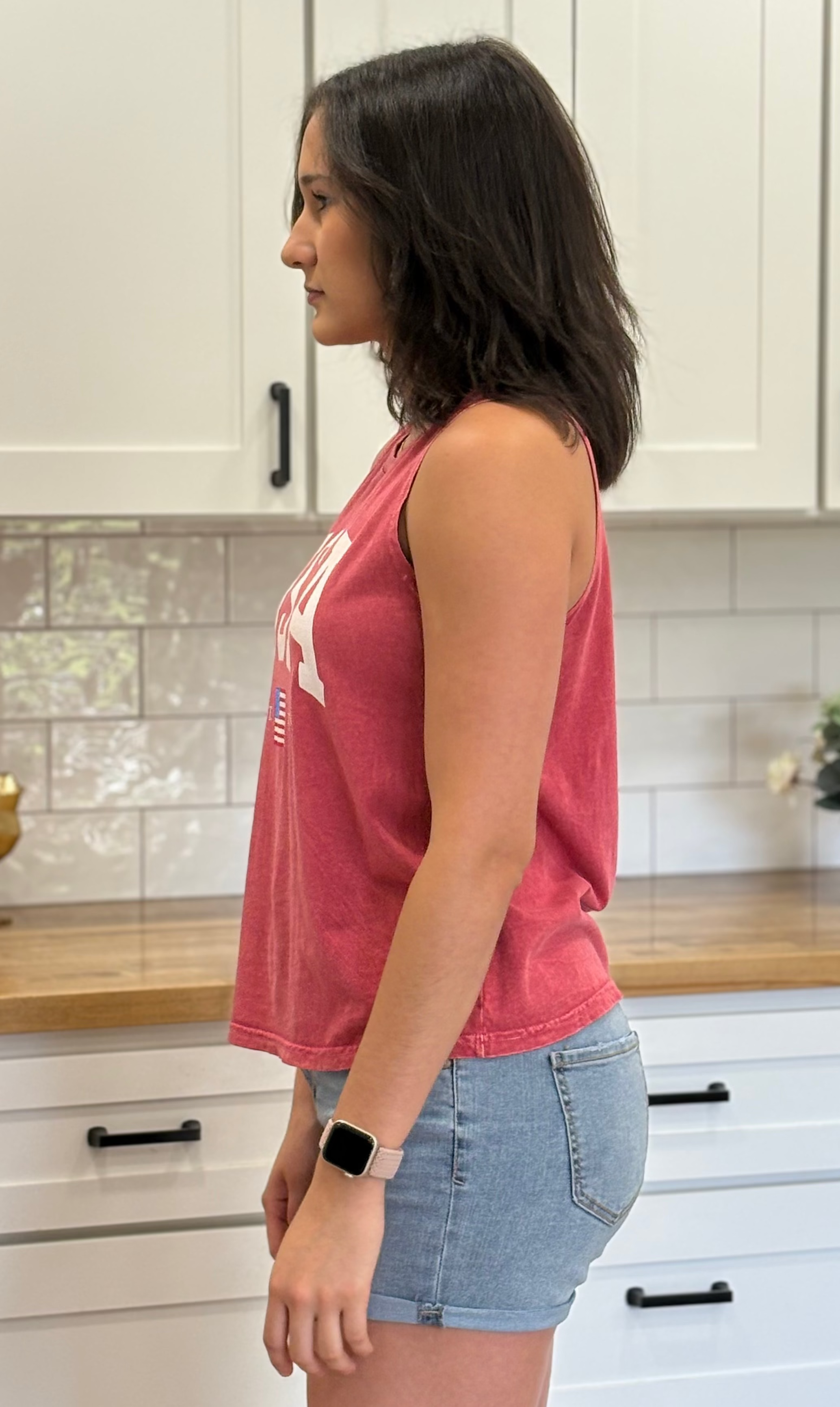 Vintage black mineral-wash “USA EST. 1776” graphic tank in soft cotton with relaxed fit and patriotic design.