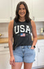 Vintage black mineral-wash “USA EST. 1776” graphic tank in soft cotton with relaxed fit and patriotic design.