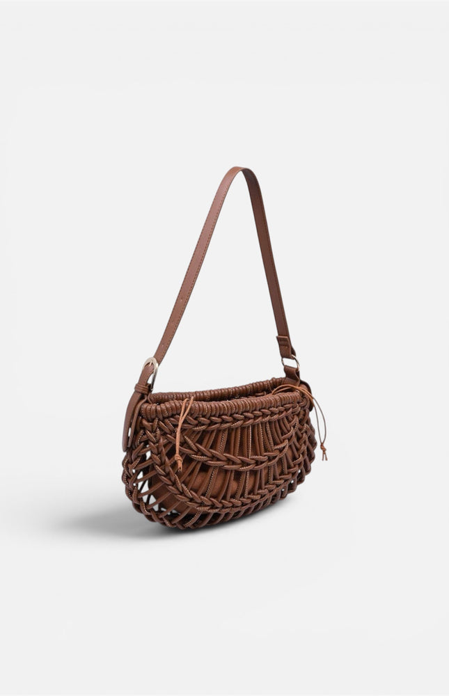 Textured, crescent-shaped woven vegan leather clutch with braided detailing, a structured base, and an adjustable shoulder strap.