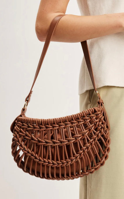 Alessia Woven Crescent Clutch with braided exterior details, sculpted half-moon silhouette, vegan leather construction, and gold hardware.