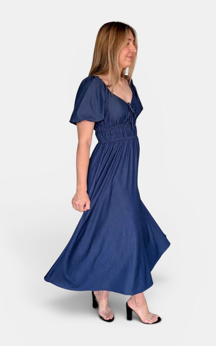 French blue Tencel blend midi dress with a sweetheart neckline, bubble sleeves, and smocked bodice.