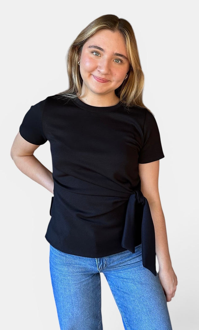 Front view of women's black micro print modal top with front knot detail.