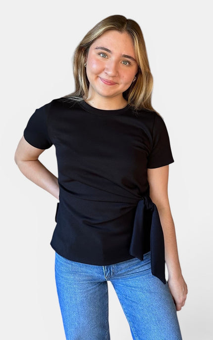 Front view of women's black micro print modal top with front knot detail.