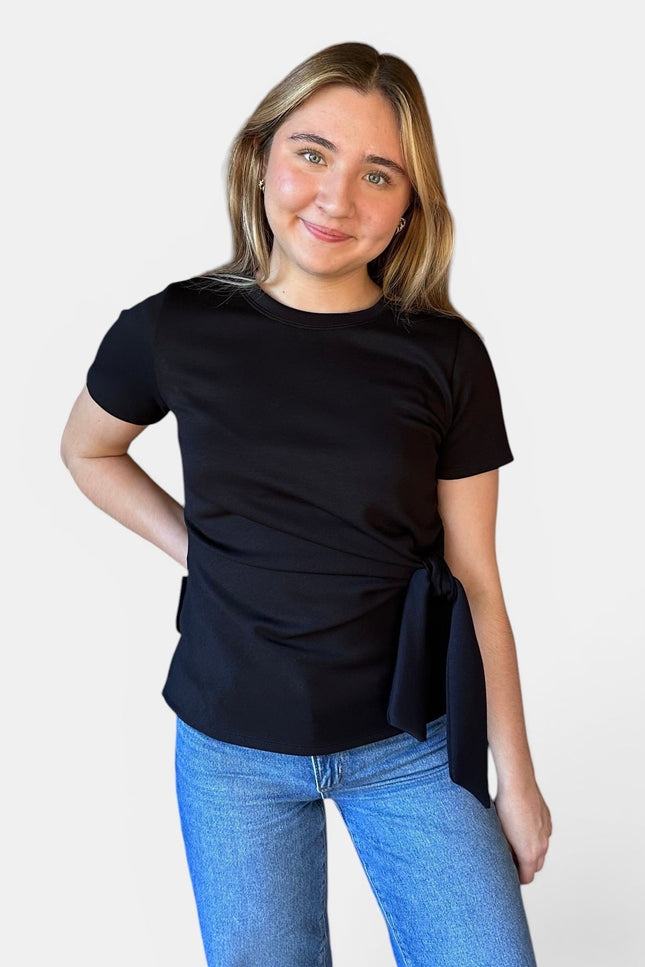 Front view of women's black micro print modal top with front knot detail.