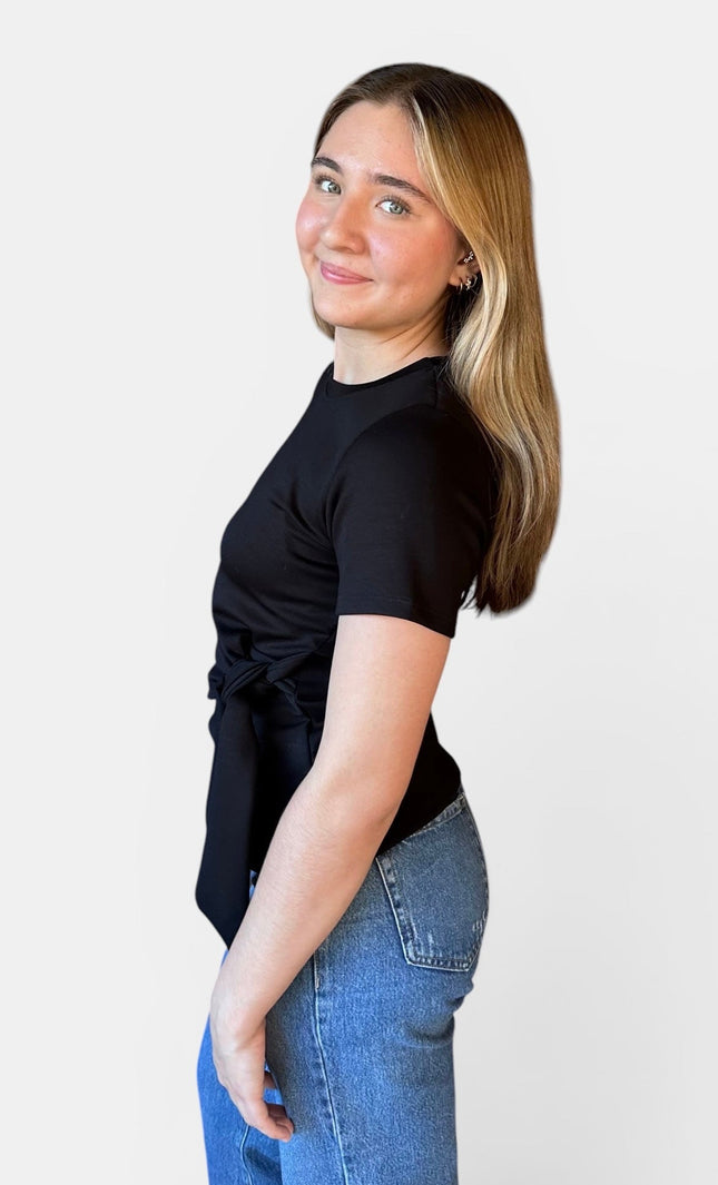 Side view of women's black modal knot top with relaxed fit.