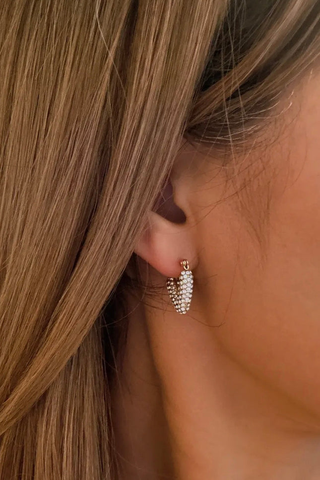 Close-up of Aurora V-Hoop Earrings in 18K gold-plated stainless steel, featuring a sleek geometric V-shape design with a polished, water-resistant finish.