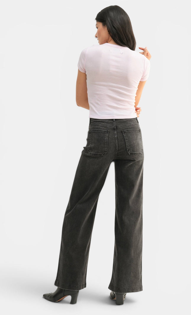 Side view of high-rise black wide-leg jeans with a relaxed full-length fit.
