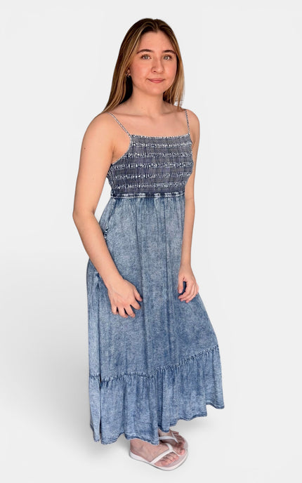 Soft Tencel midi dress with a smocked bodice and airy tiered skirt.