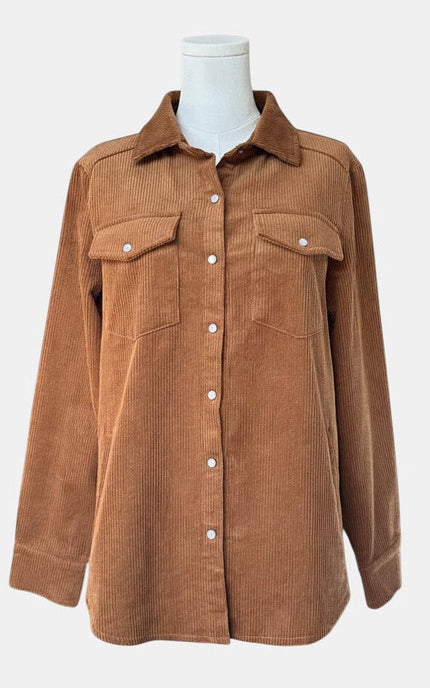 A brown corduroy button-up shirt jacket with two chest flap pockets, displayed on a white mannequin torso against a light gray background.