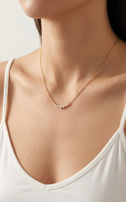Side view of the necklace on the neck showing the slim chain and lightweight drape.