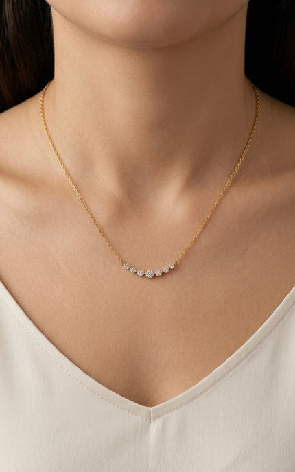 Zircon bar necklace worn on the neck, showing the delicate row of stones and minimal gold chain.