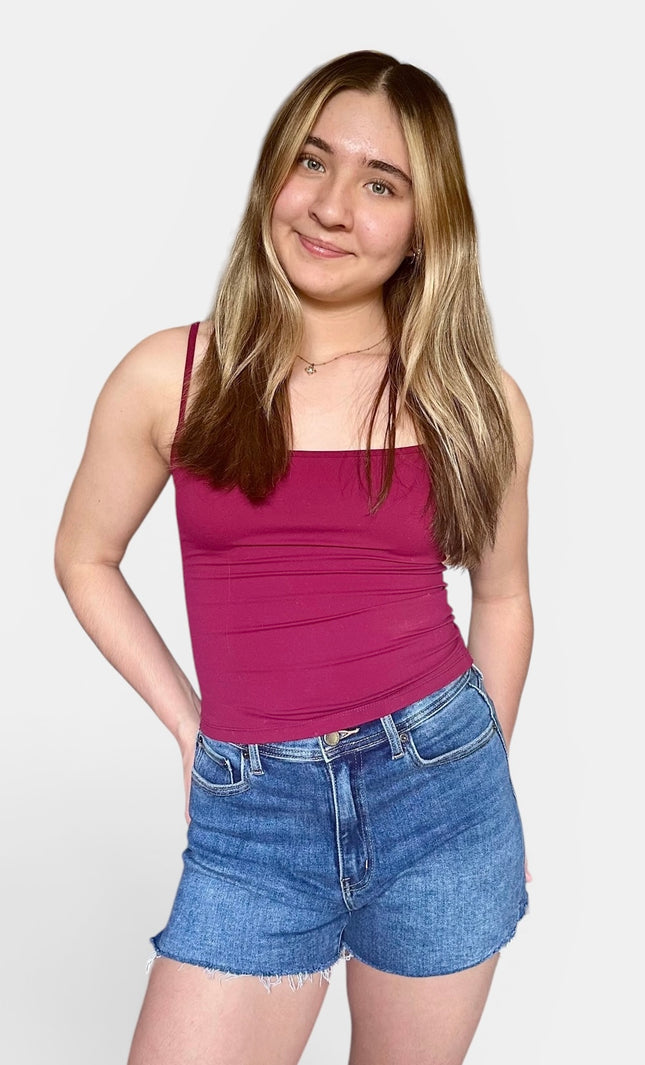 Comfortable medium-wash jean shorts with a raw hem and soft stretch for everyday wear.