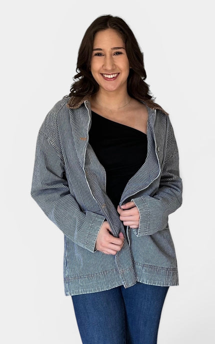 Front angle of utility-inspired denim barn coat.