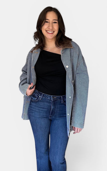 Front angle of utility-inspired denim barn coat.