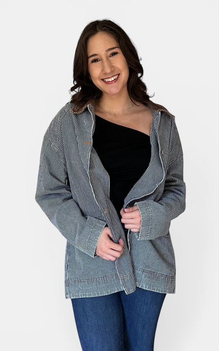 Front angle of utility-inspired denim barn coat.