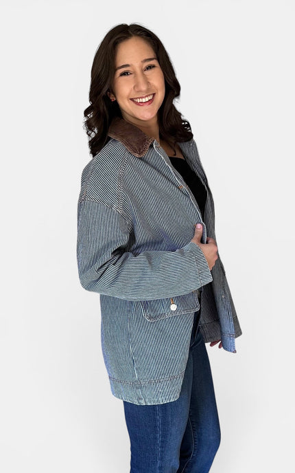 Side profile of women's classic denim barn coat.
