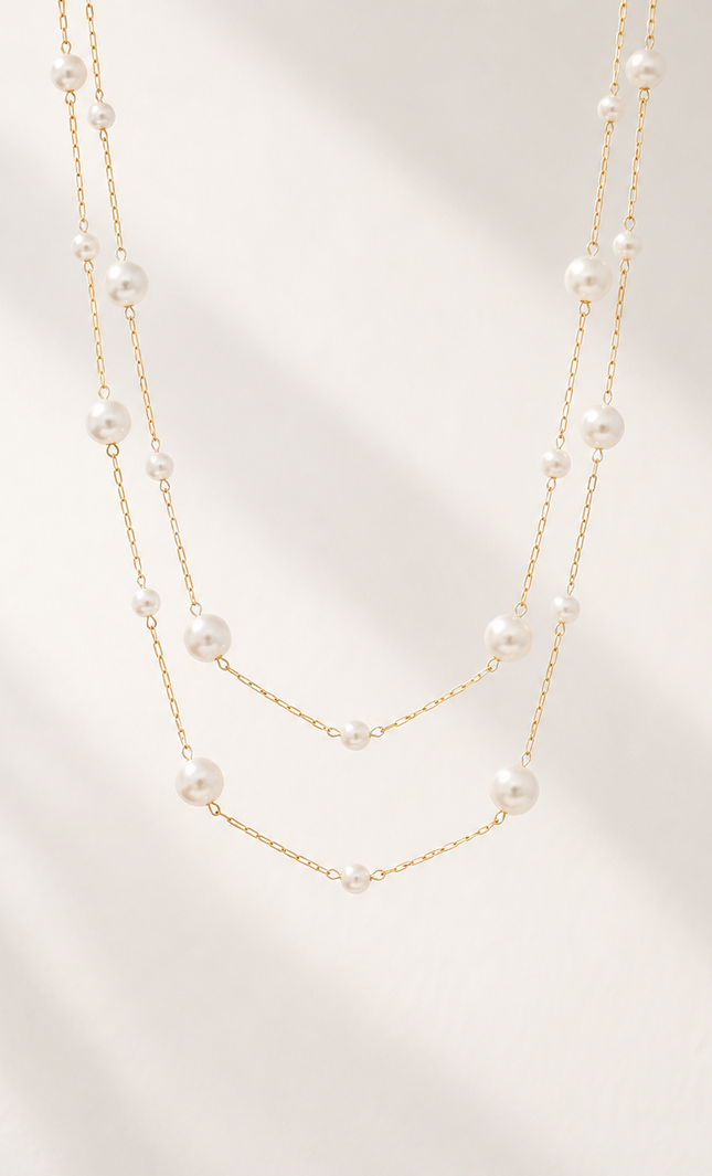 Double strand 18k gold paperclip chain necklace with mixed size imitation pearl stations, featuring delicate 3.2mm and 5mm pearls on layered chains with a timeless, elegant design.