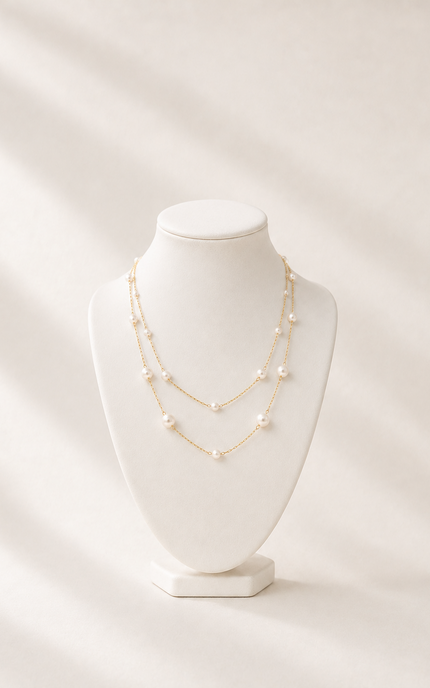 Double strand 18k gold paperclip chain necklace on necklace form with mixed size imitation pearl stations, featuring delicate 3.2mm and 5mm pearls on layered chains with a timeless, elegant design.