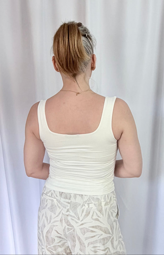 Back view of fitted double-layer rayon spandex tank top with smooth seamless finish.