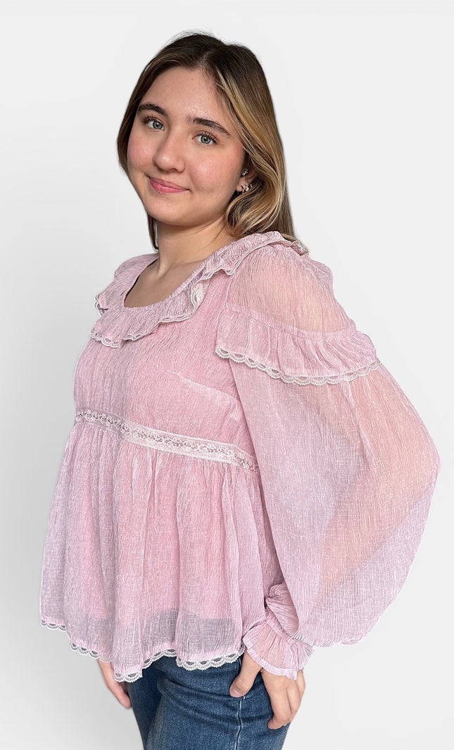 Side view of women's empire waist chiffon blouse with elastic cuff sleeves.