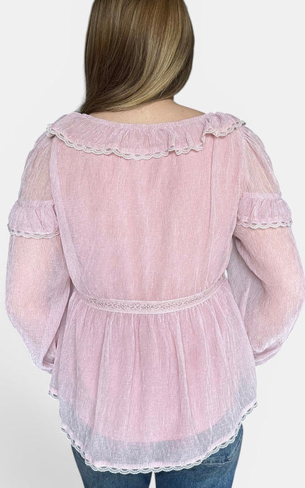Back view of women's romantic peasant blouse with gathered shoulders.
