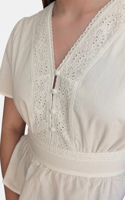 Eyelet cotton shirt with soft feminine silhouette