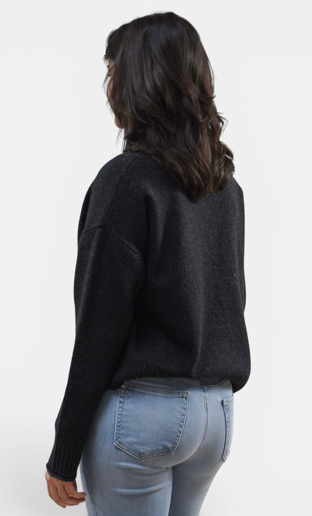 Black long sleeve mock neck sweater in a comfortable wool blend knit.
