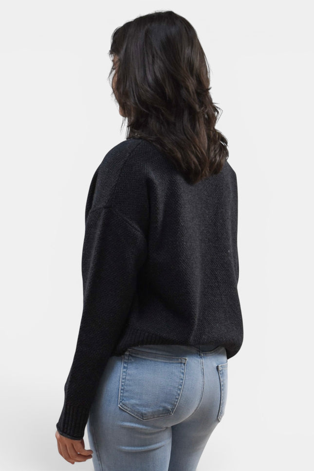 Black long sleeve mock neck sweater in a comfortable wool blend knit.