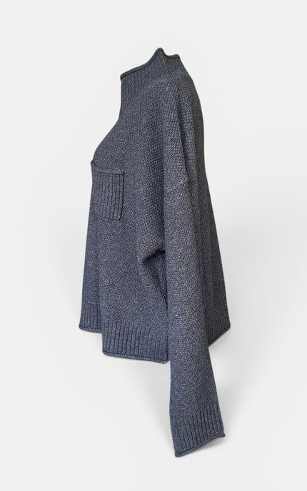 Women's cozy black knit sweater with long sleeves and a polished look.