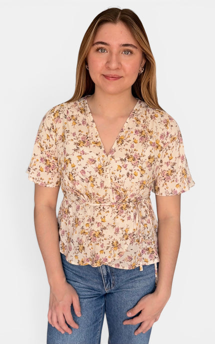 Floral wrap blouse in lightweight 100% rayon with a waist tie and flattering V-neckline.
