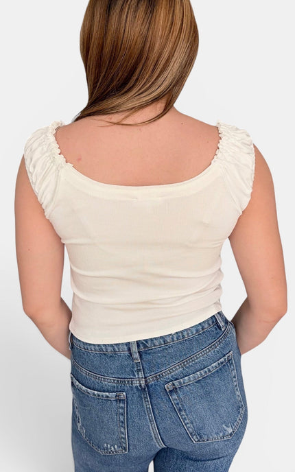 Back view of fitted ribbed tank with scoop neckline, ruched straps, and soft cotton-spandex stretch