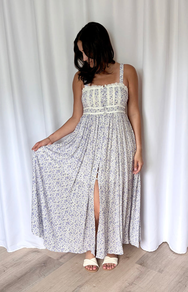 Flowing skirt of the floral maxi dress shown in motion.