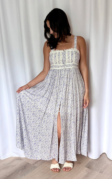 Flowing skirt of the floral maxi dress shown in motion.