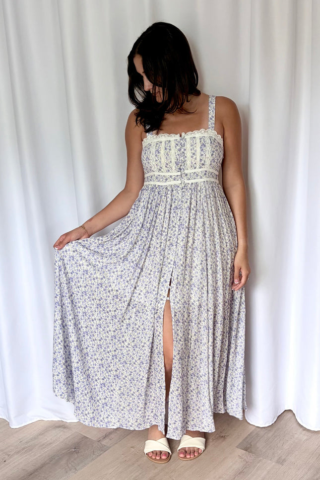 Flowing skirt of the floral maxi dress shown in motion.