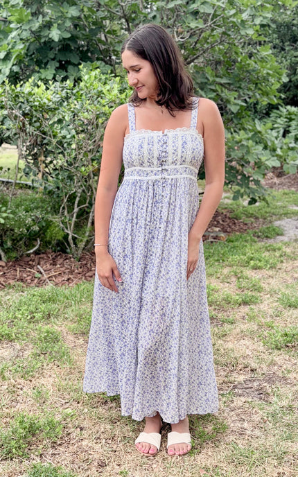 Front view of the Evangeline Floral Button Maxi in soft French blue and ivory floral with functional button‑down silhouette.