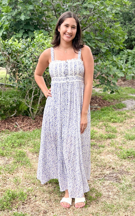 Full‑length view of the French blue and ivory floral maxi dress with lace inset detail at the bust.
