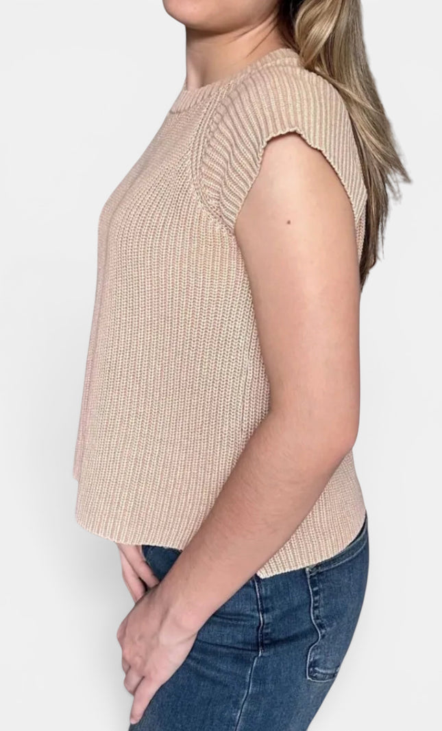 Beige ribbed knit sleeveless top with cap sleeves and blue jeans, shown from a side profile against a light gray background.