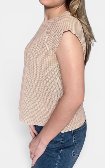 Beige ribbed knit sleeveless top with cap sleeves and blue jeans, shown from a side profile against a light gray background.
