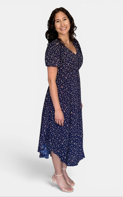     Timeless floral midi dress with a flattering fit, puff sleeves, and midi length.