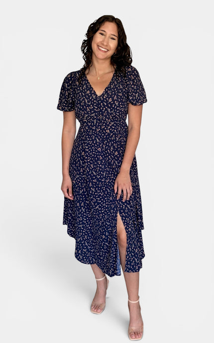 Front view of modest floral midi dress with puff sleeves, V-neckline, and elegant everyday styling.