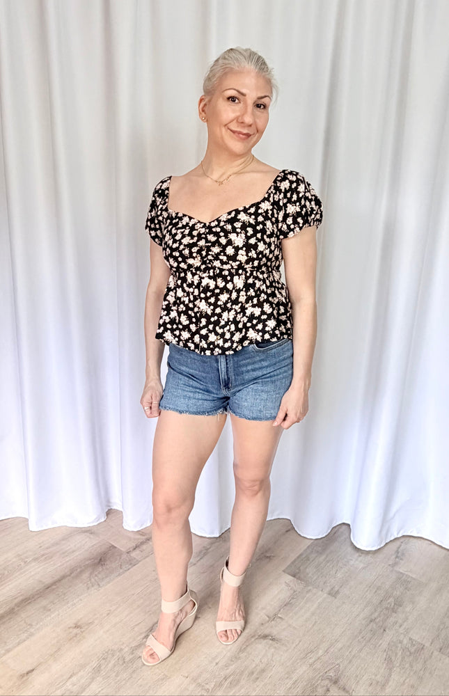 Floral sweetheart top front view featuring soft rayon fabric and flattering fitted silhouette.