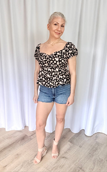 Floral sweetheart top front view featuring soft rayon fabric and flattering fitted silhouette.