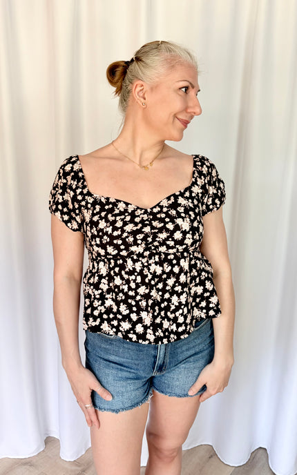 Women's floral sweetheart neckline top shown from front with lightweight breezy drape.