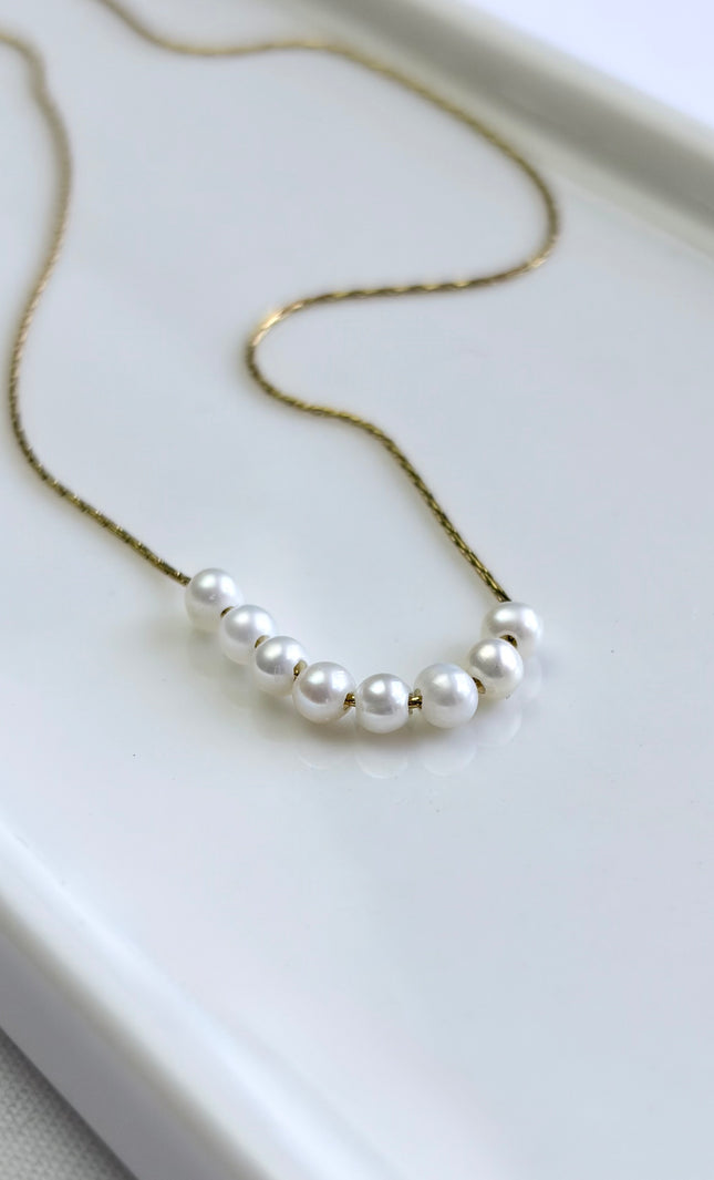 Freshwater pearl necklace with 18k gold PVD chain, lightweight, hypoallergenic, and tarnish‑resistant.