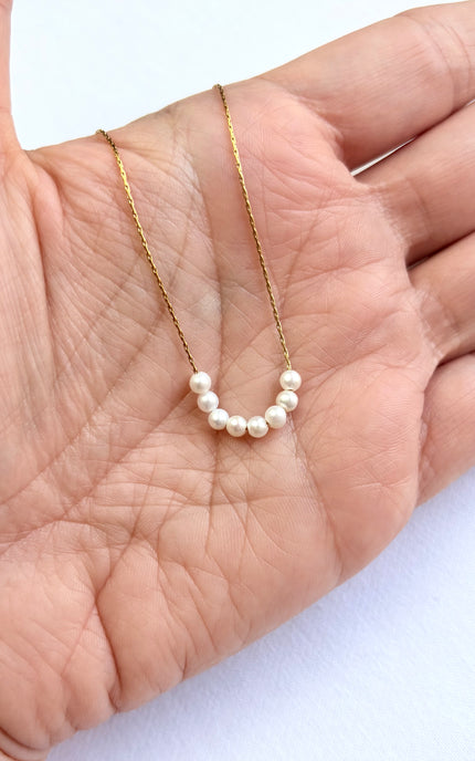 Delicate freshwater pearl necklace with gold PVD chain, feminine and minimal for everyday wear.