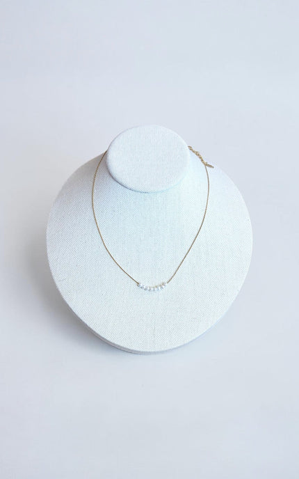 40cm gold PVD stainless steel necklace with freshwater pearl detail and 5cm extender, hypoallergenic and waterproof.